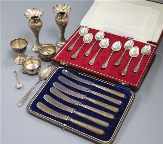 A cased set of eight 1970s silver picture back teaspoons by Mappin & Webb, a cased set of cake knives, silver spill vases etc.
